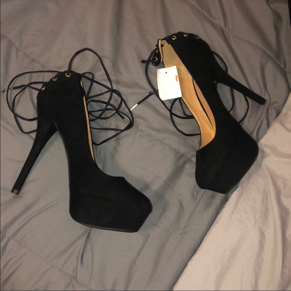 Stiletto black heels that tie up the leg